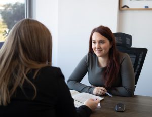Two women talking at the office